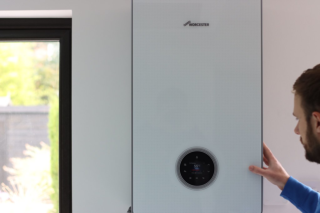 Engineer installing a modern Worcester combi boiler in a Harrogate home